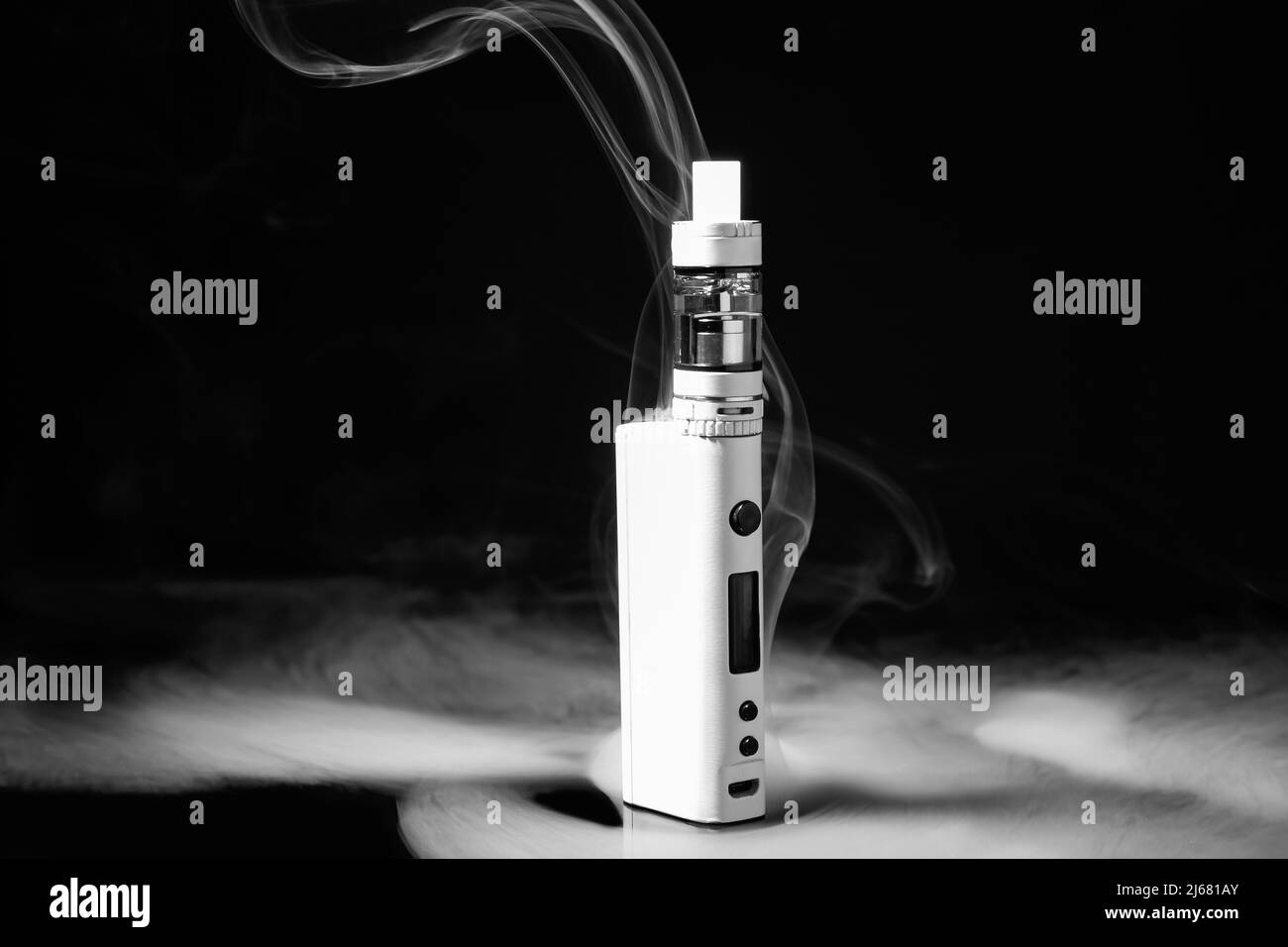 Modern vape mod and smoke on black background Stock Photo