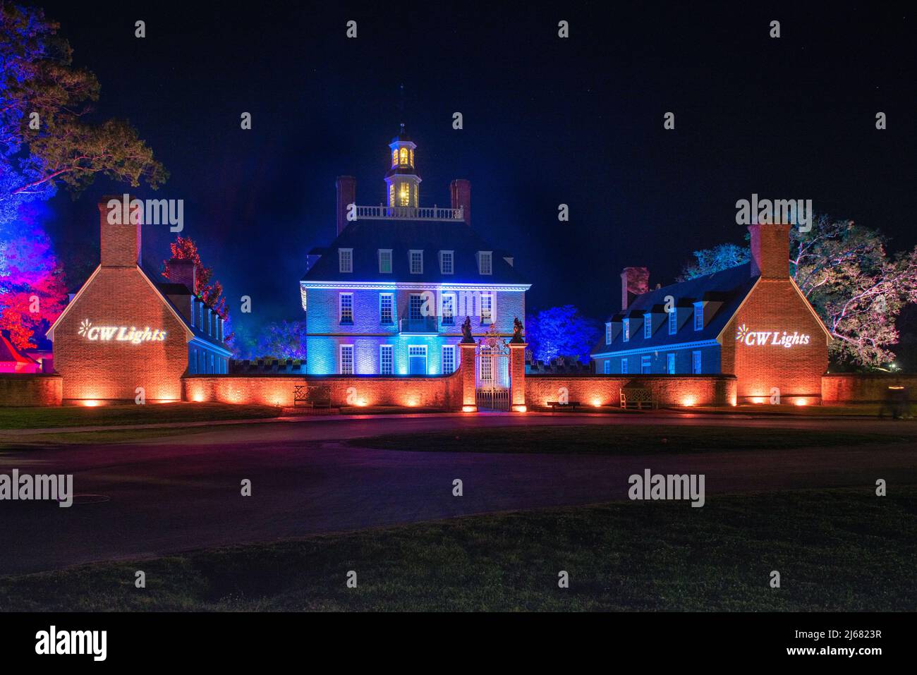 Colonial Williamsburg Governors Palace entrance seen from the Palace Green, CW Light show at night. Richmond Lighting and Sound Company Installed. Stock Photo