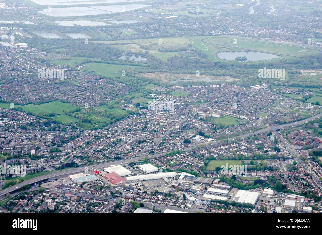 View from the air of the West London suburb of Sunbury-on-Thames in the  Borough of Spelthorne.  The Kempton Park horse racing track is to the top rig Stock Photo