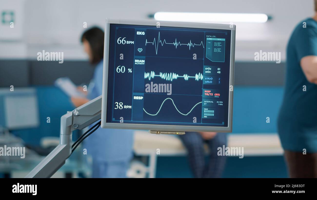 Heart rate monitor at checkup visit to measure heartbeat and pulse pressure, connected to