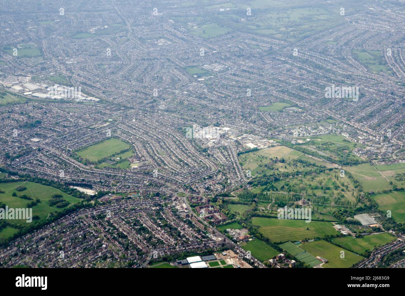 Aerial view looking South across the London Borough of Sutton with the North East Surrey Crematorium towards the bottom of the image and Merton, Morde Stock Photo