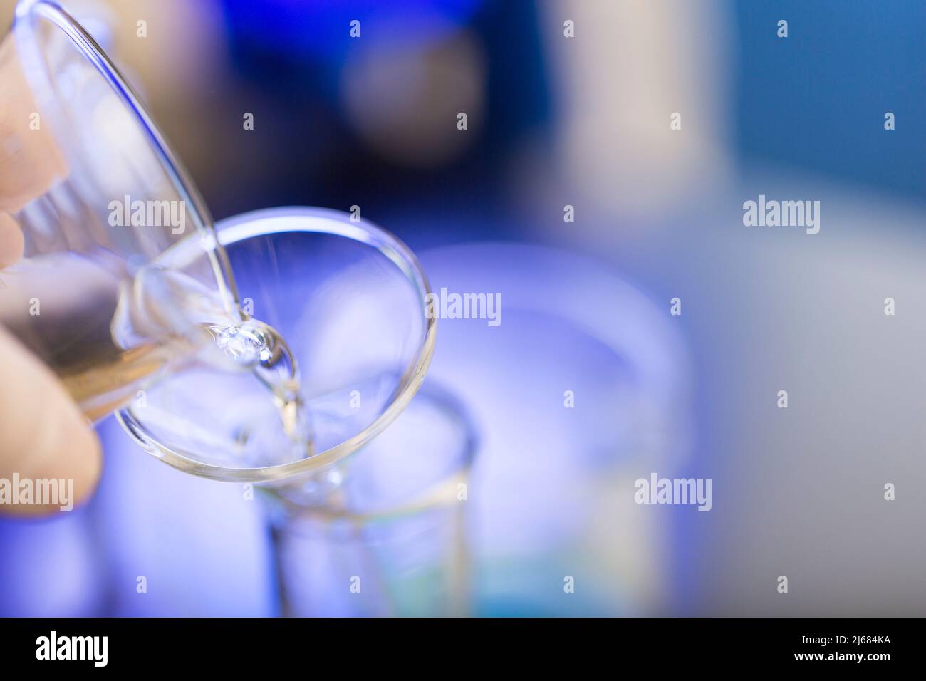 Dumping reagents into test tubes, chemistry LABS - stock photo Stock Photo