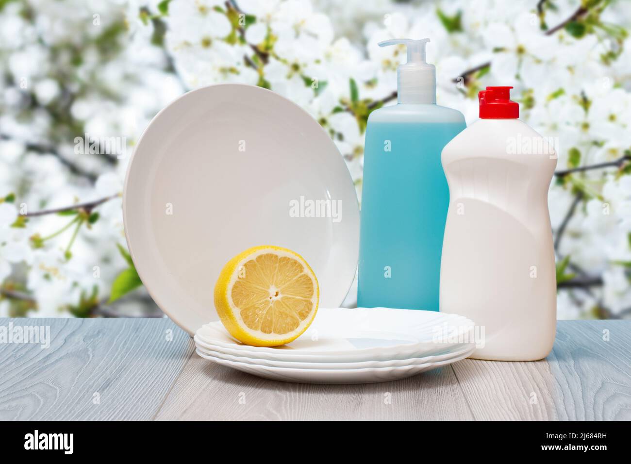 Plastic bottles of dishwashing liquid, glass and tile cleaner, clean