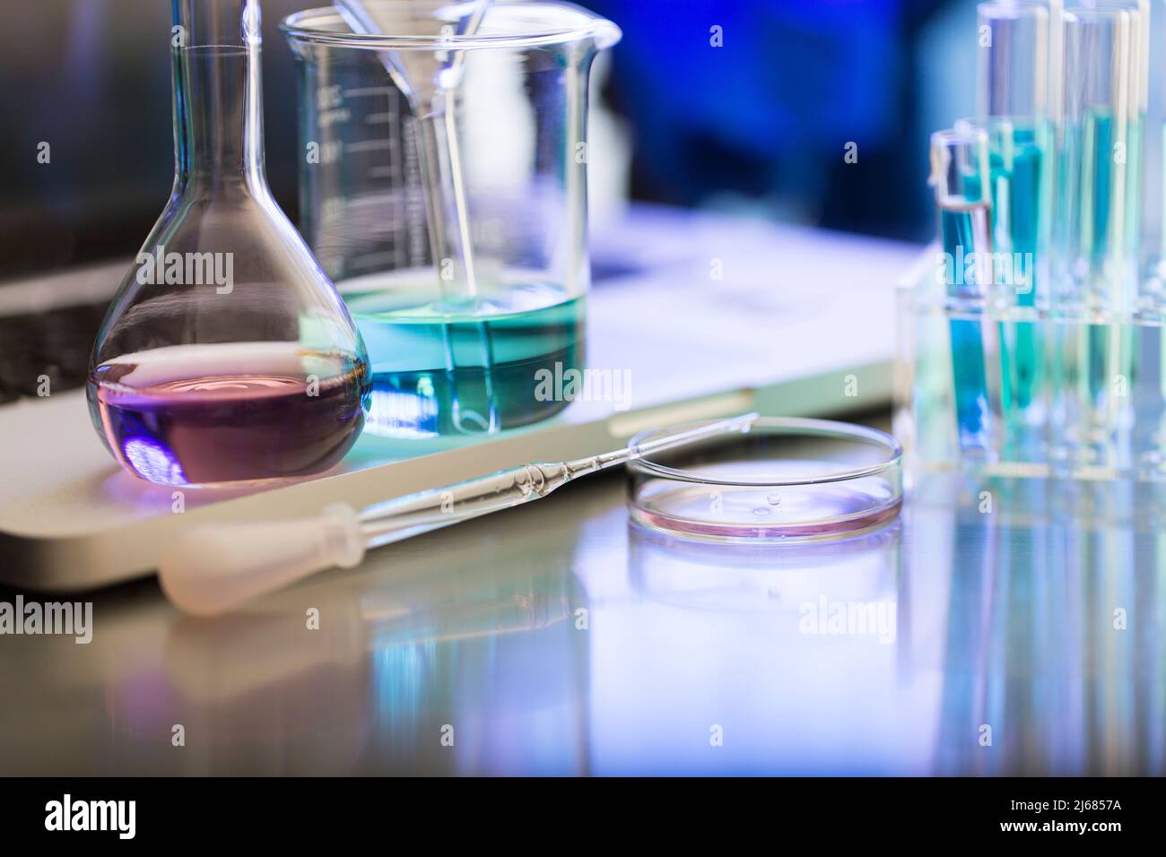 Group of object, dropper, conical flask, beaker, funnel, Petri dish, test tube, laptop - stock photo Stock Photo