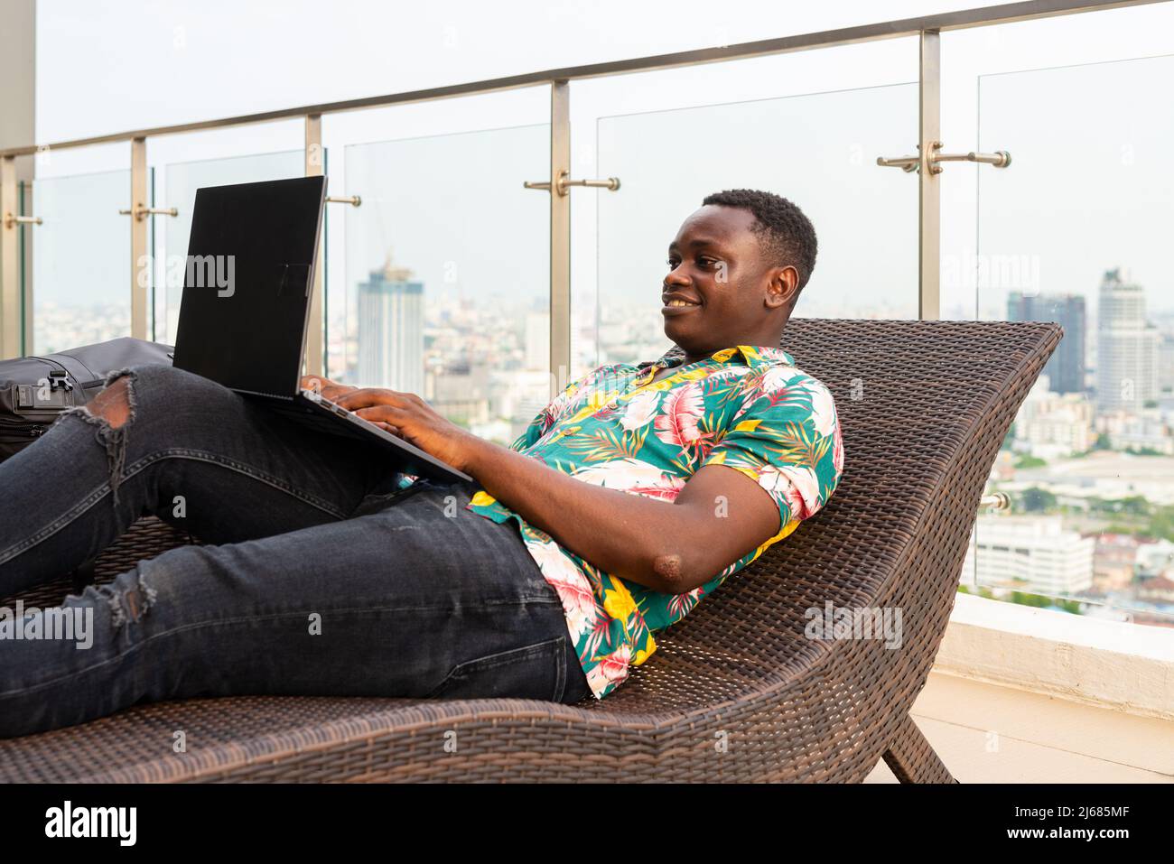 Portrait of handsome young African man enjoying summer Stock Photo