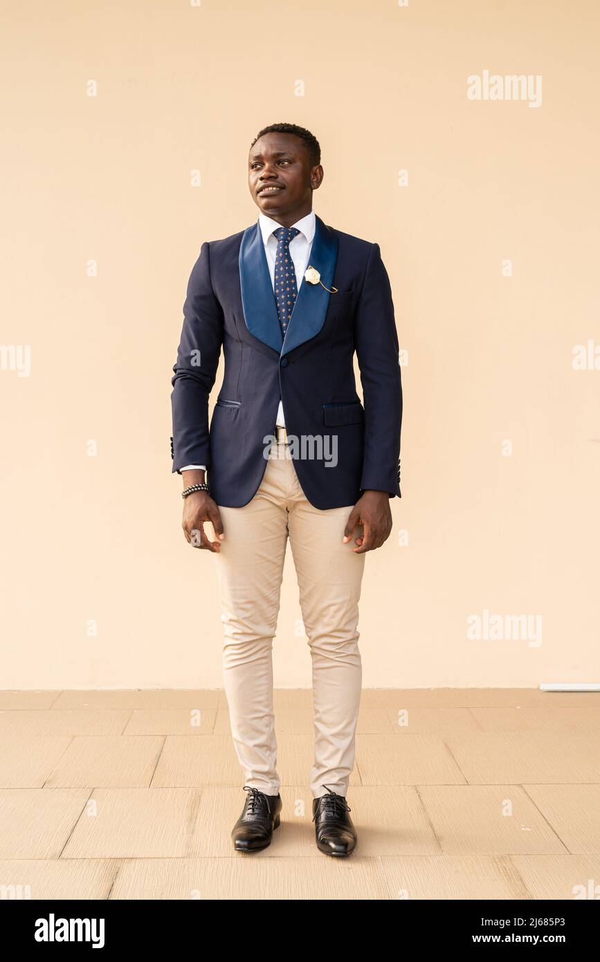 Portrait of handsome young African man wearing suit Stock Photo - Alamy