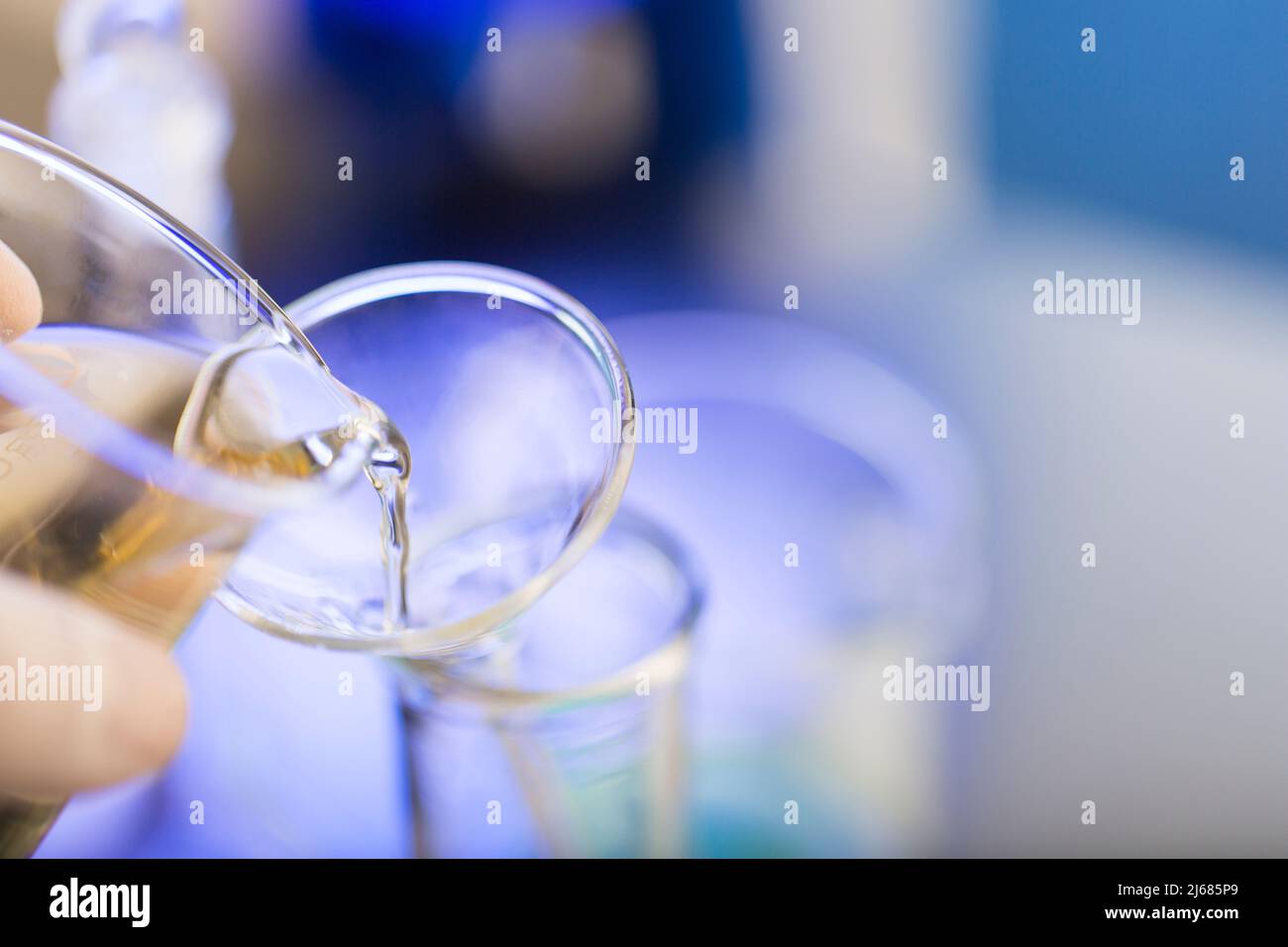 Dumping reagents into test tubes, chemistry LABS - stock photo Stock Photo