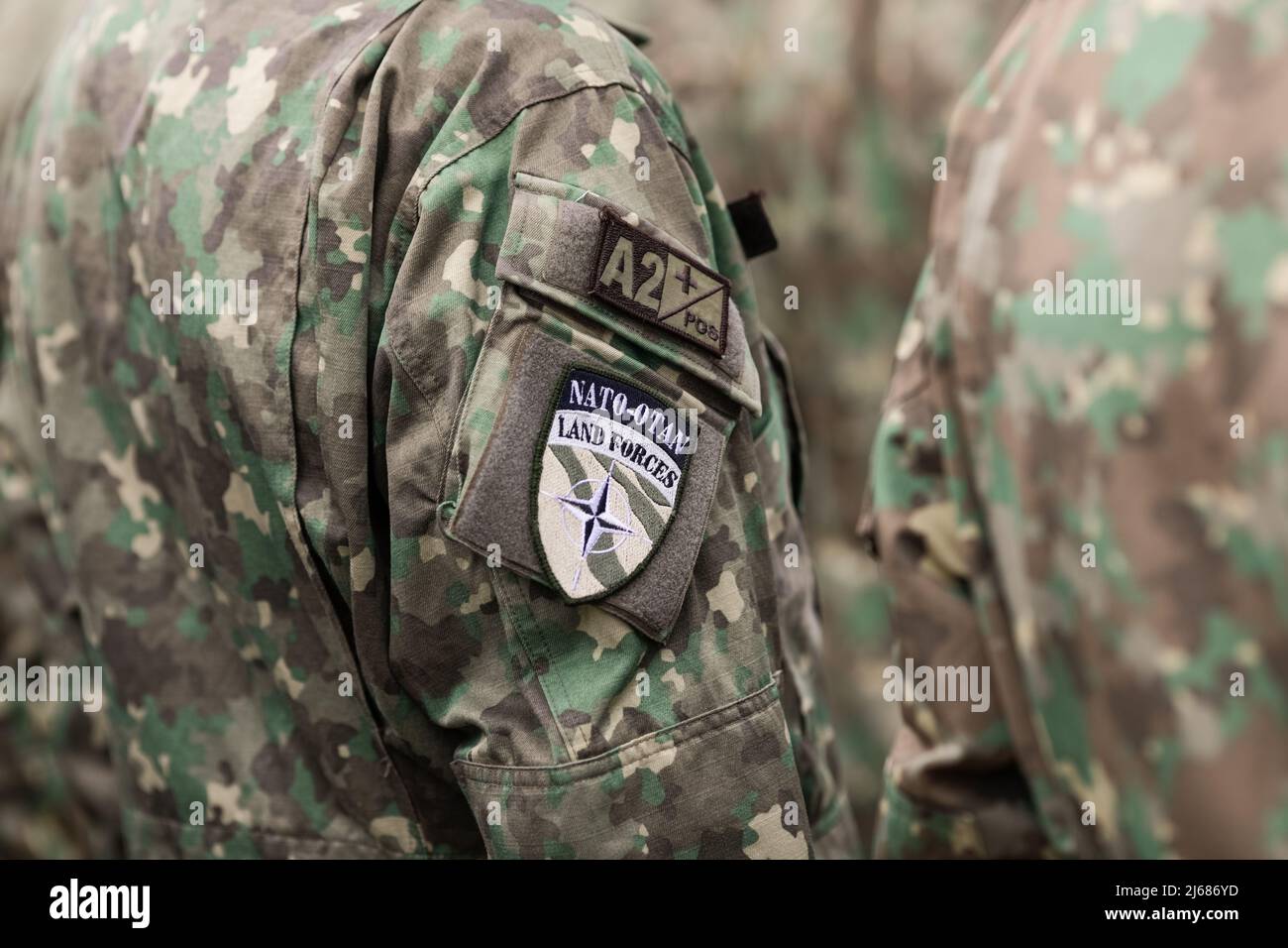 Bucharest, Romania - April 28, 2022: Shallow depth of field details with a Romanian soldier NATO armband (brassard, armlet). Stock Photo