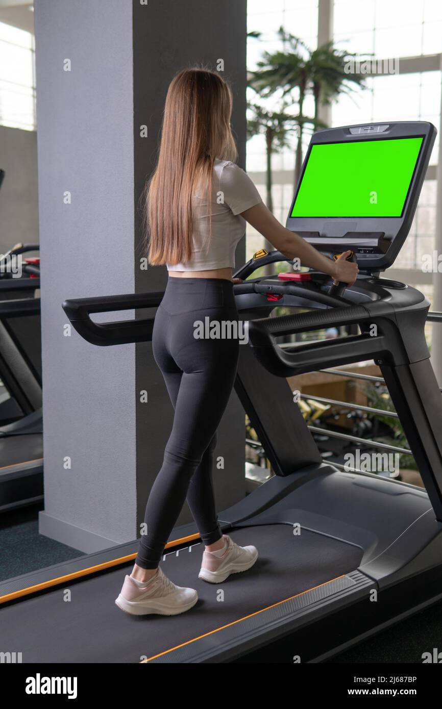 Woman indoors young length treadmill profile full active female, for lifestyle attractive for body and adult gym, sportswoman together. Man care slim Stock Photo