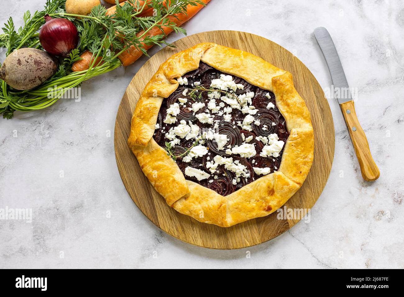 Savory root vegetable galette. Served with goat cheese Stock Photo Alamy
