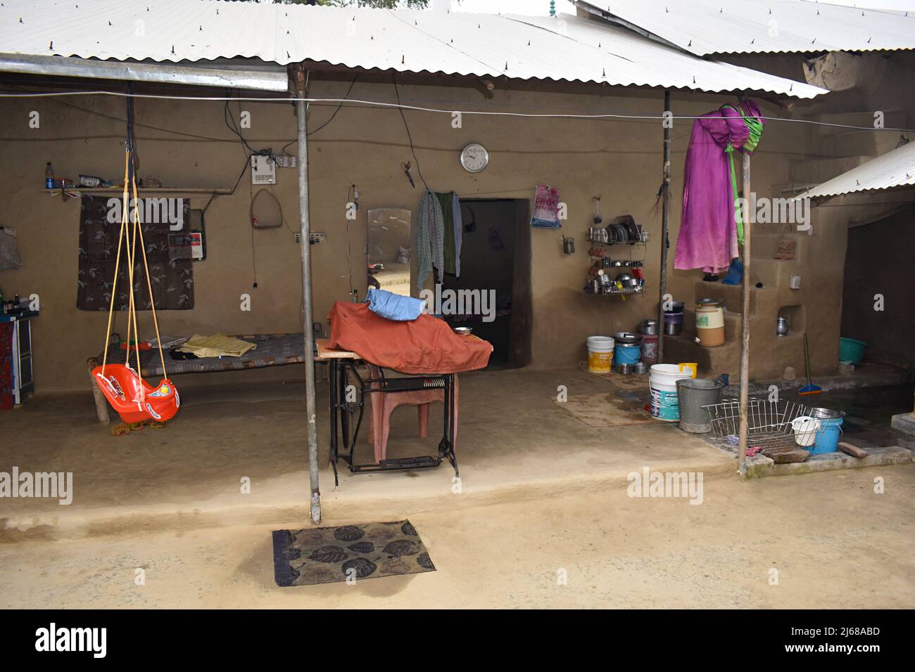 Interiors of Indian village house, hammock, Sewing machine, Amehti Village, Uttar Pradesh, India Stock Photo