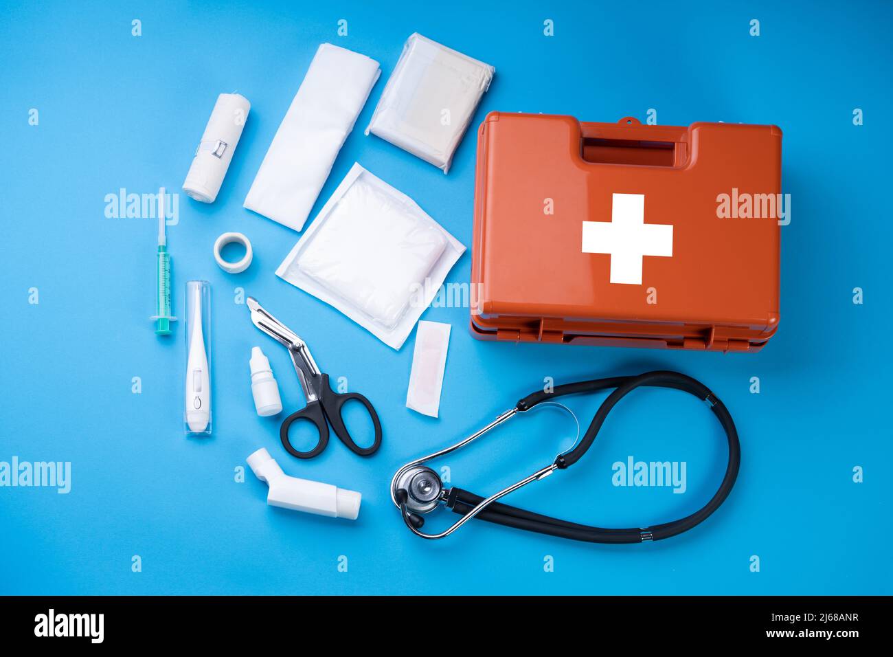 First Aid Kit With Medical Equipment On Blue Background Stock Photo - Alamy