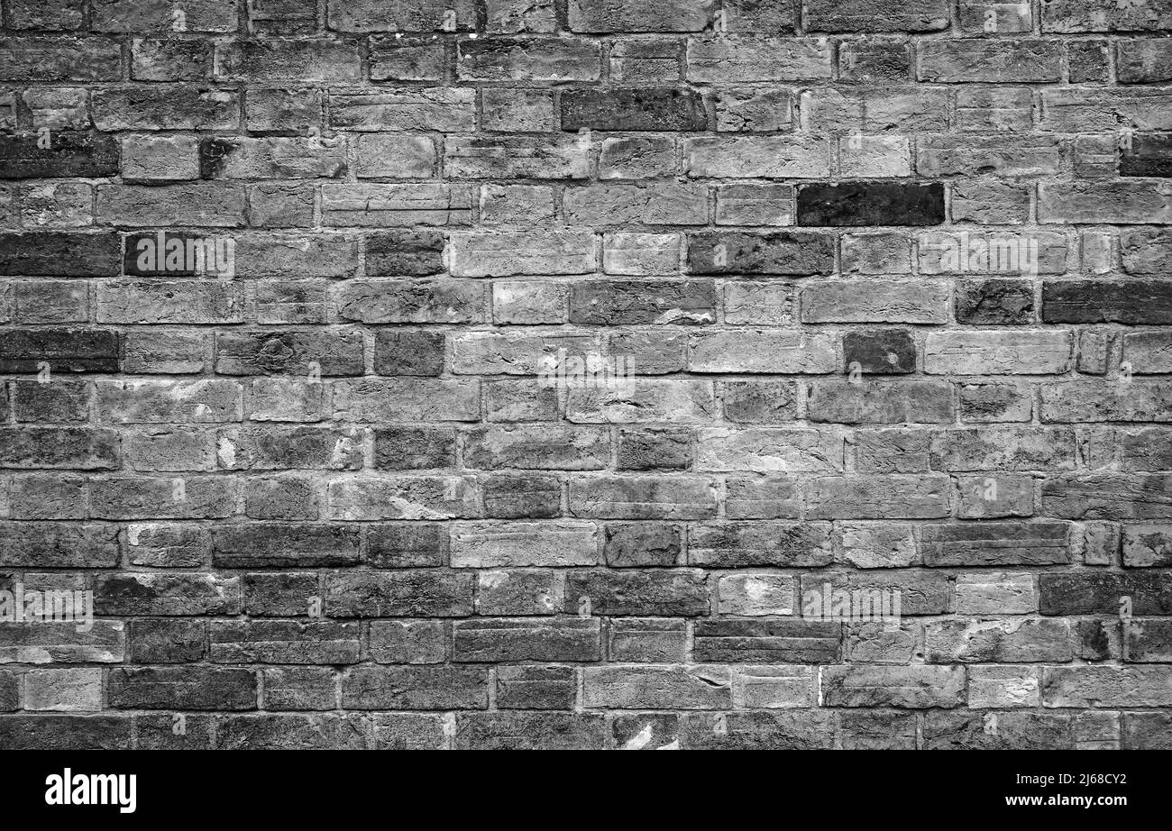 Old dark gray brick wall, background photo texture Stock Photo Alamy
