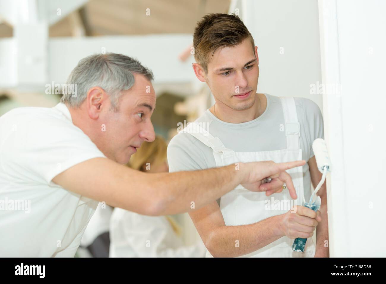 young house painter and decorator apprentice trainee Stock Photo