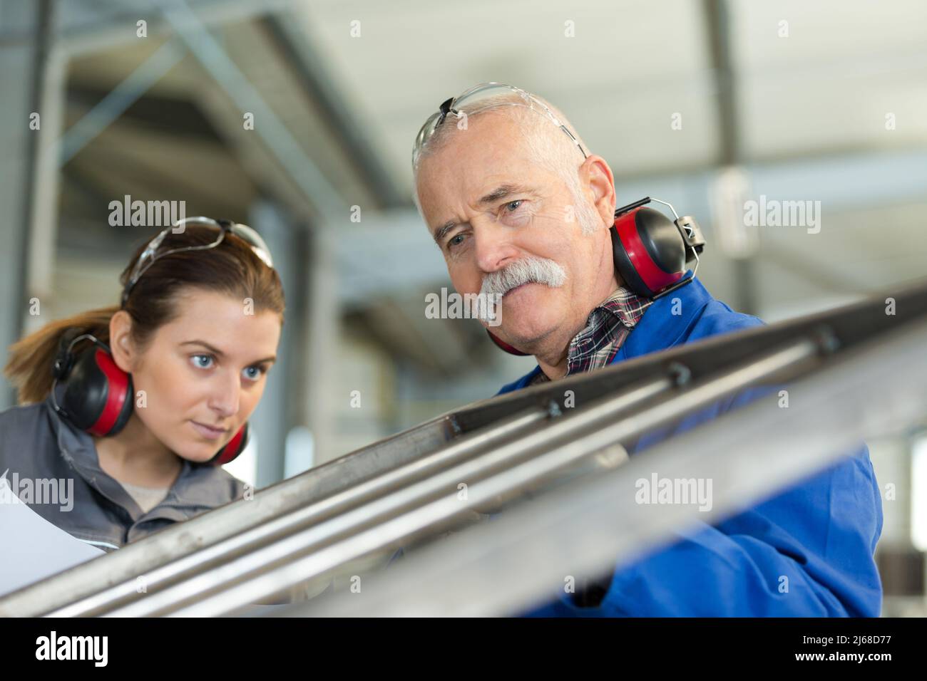 female manufacturing labourer checking finishing Stock Photo Alamy