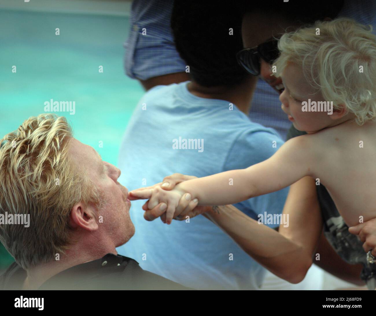 MIAMI BEACH, FL - SEPTEMBER 04: Tennis champ Boris Becker's and wife Sharlely Kerssenberg ('Lilly', model, m. Jun-2009, one son), spend some pool time with their sons Noah Gabriel (b. 18-Jan-1994), Elias Balthasar (b. 4-Sep-1999), and 1-year-old son Amadeus. Lilly and Boris were at the pool with Boris's X-wife Barbara Feltus (m. 17-Dec-1993, div. 15-Jan-2001, two sons) for one of her sonÕs birthday.  On September 4, 2011 in Miami, Florida.    People:   Boris Becker Amadeus Becker Stock Photo