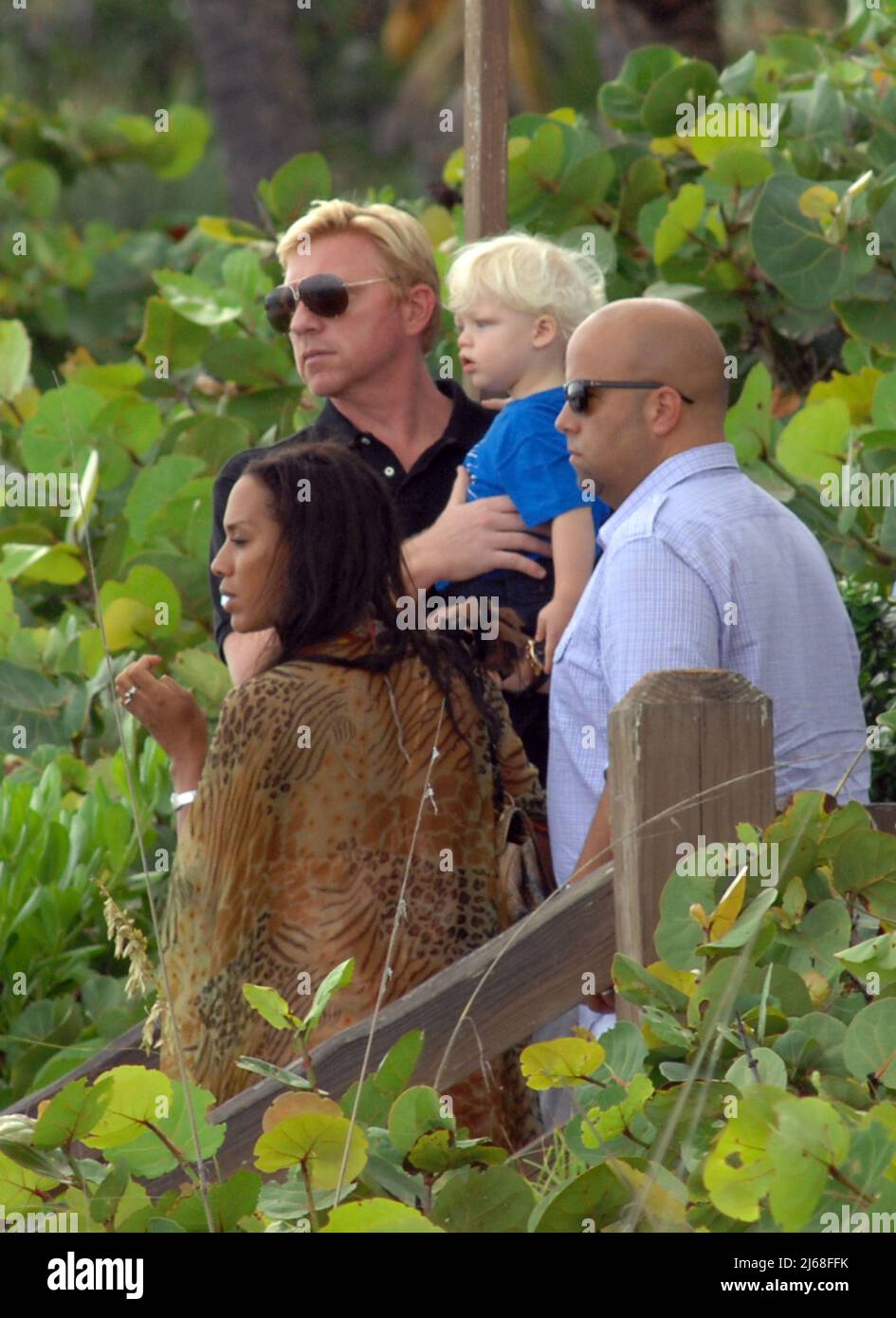 MIAMI BEACH, FL - SEPTEMBER 04: Tennis champ Boris Becker's and wife Sharlely Kerssenberg ('Lilly', model, m. Jun-2009, one son), spend some pool time with their sons Noah Gabriel (b. 18-Jan-1994), Elias Balthasar (b. 4-Sep-1999), and 1-year-old son Amadeus. Lilly and Boris were at the pool with Boris's X-wife Barbara Feltus (m. 17-Dec-1993, div. 15-Jan-2001, two sons) for one of her sonÕs birthday.  On September 4, 2011 in Miami, Florida.    People:   Boris Becker Amadeus Becker Stock Photo