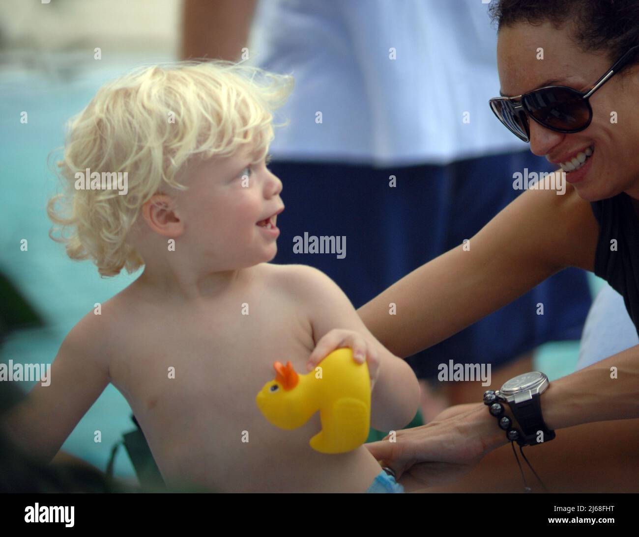 MIAMI BEACH, FL - SEPTEMBER 04: Tennis champ Boris Becker's and wife Sharlely Kerssenberg ('Lilly', model, m. Jun-2009, one son), spend some pool time with their sons Noah Gabriel (b. 18-Jan-1994), Elias Balthasar (b. 4-Sep-1999), and 1-year-old son Amadeus. Lilly and Boris were at the pool with Boris's X-wife Barbara Feltus (m. 17-Dec-1993, div. 15-Jan-2001, two sons) for one of her sonÕs birthday.  On September 4, 2011 in Miami, Florida.   People:  Sharlely Kerssenberg Amadeus Becker Stock Photo