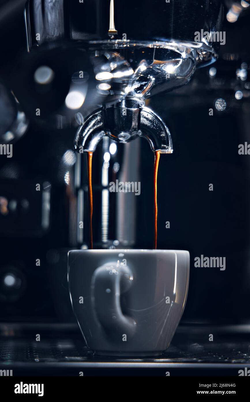 Espresso double shot dripping into a cup Stock Photo Alamy