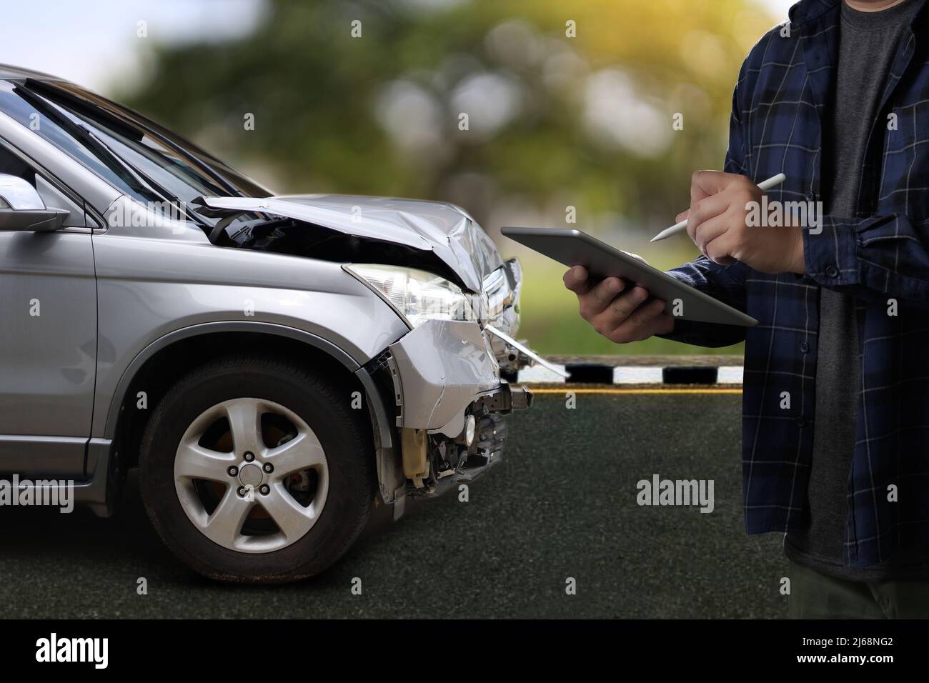 man holding smartphone and take photo of car accident call for help ...
