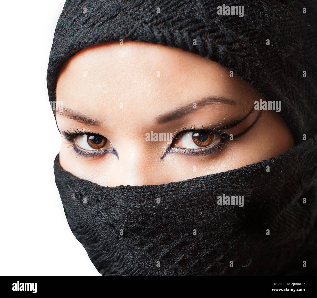 Portrait of Kazakh Islamic religious beautiful girl. Asian Muslim woman is wearing hijab scarf with make-up Stock Photo