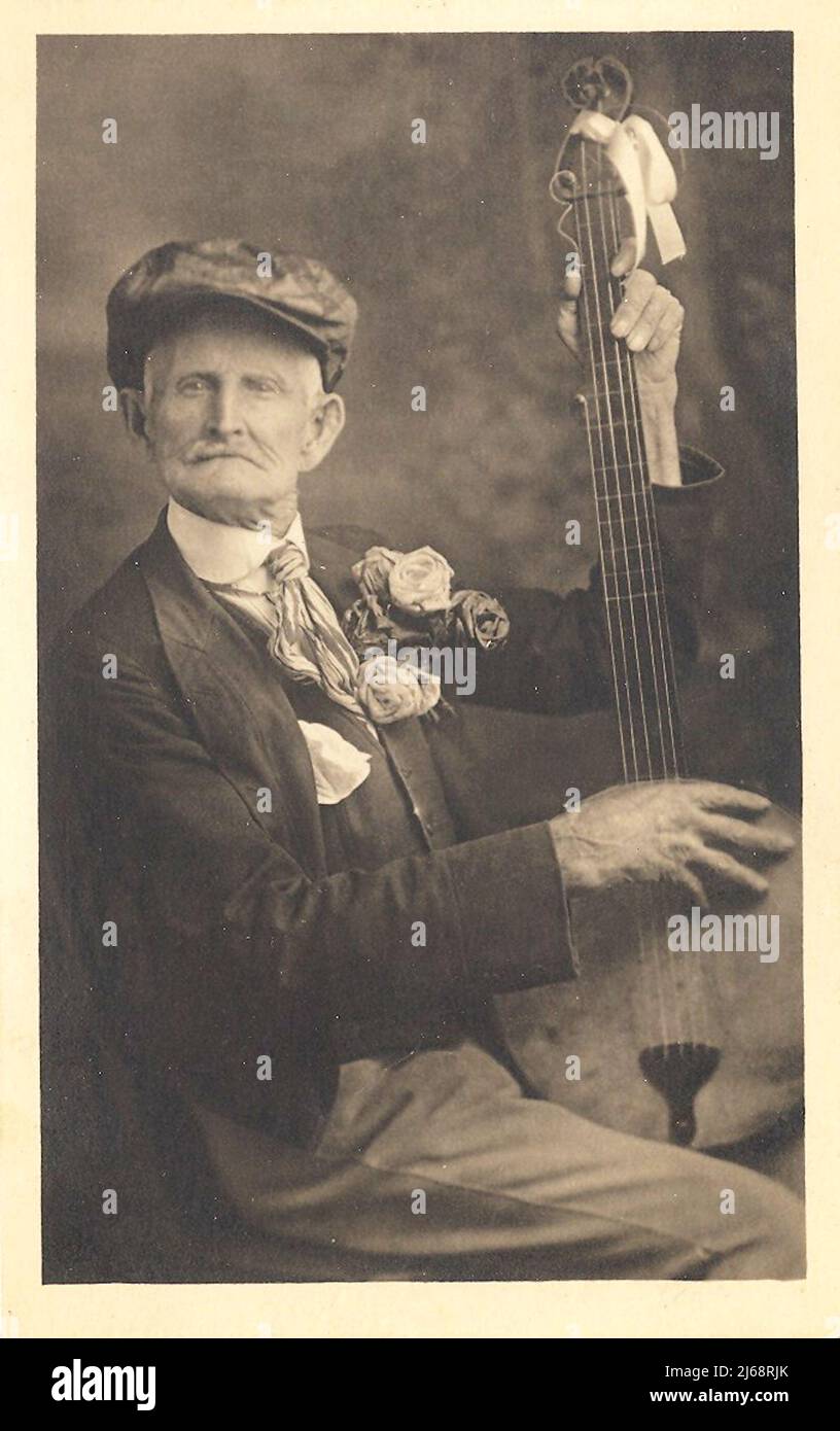 Banjo Player - Postcard - 1908 Stock Photo