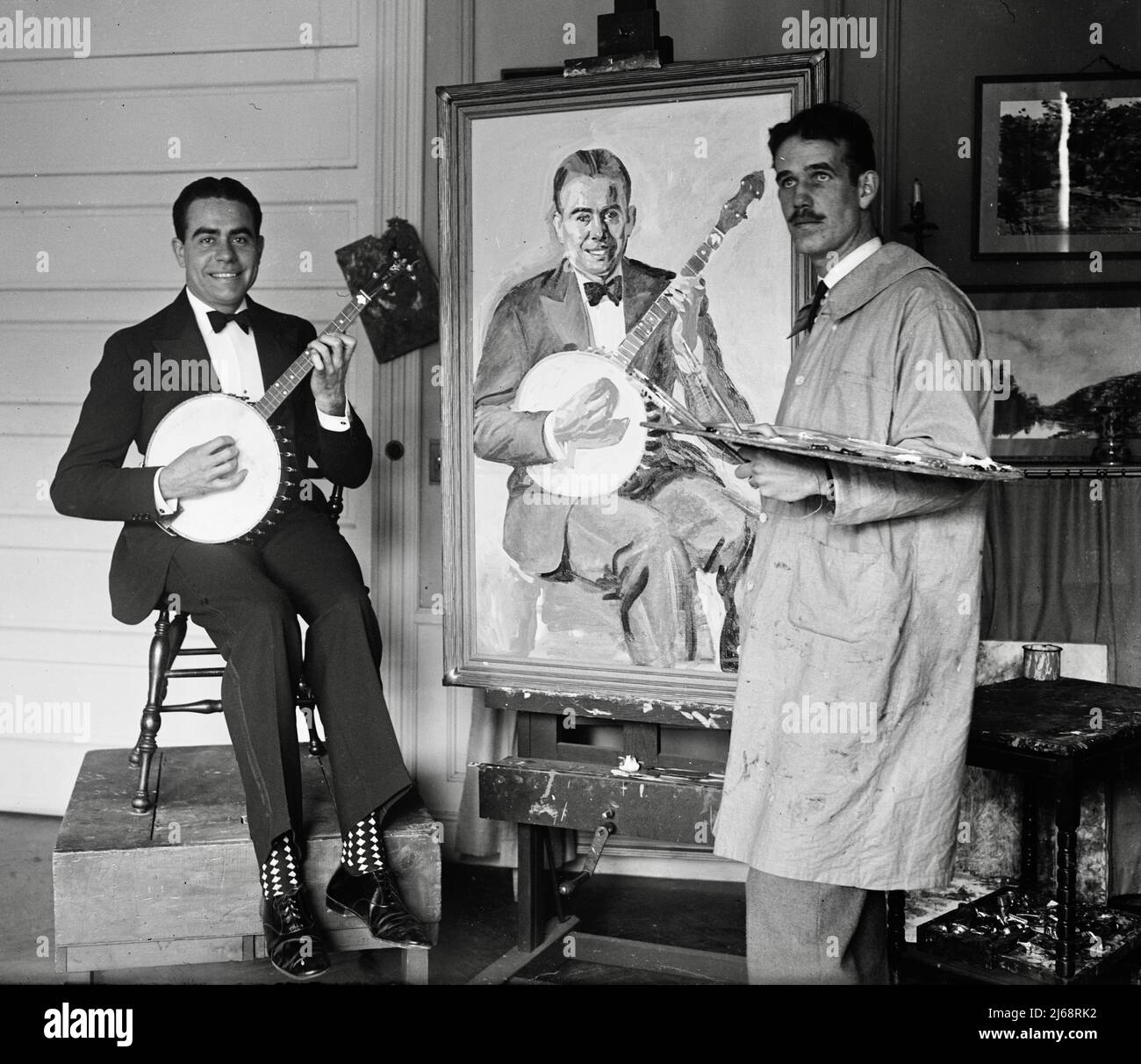 Artist Painting a Man with a Banjo - 1924 Stock Photo