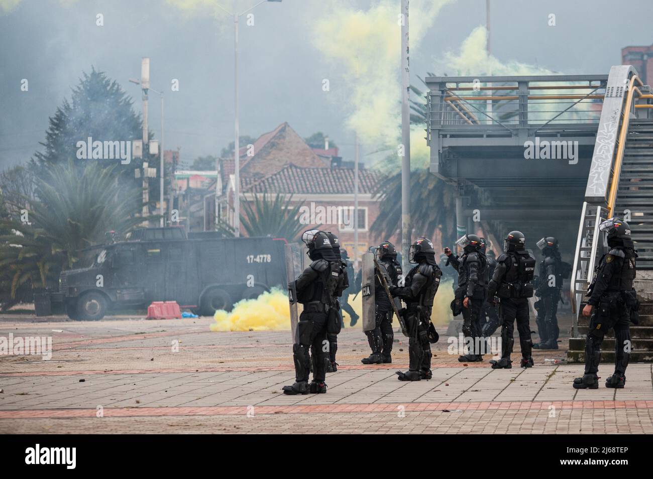 Colombia's riot police clash with demonstrators during the 28 of April commemorative demonstrations against the government of president Ivan Duque and Stock Photo
