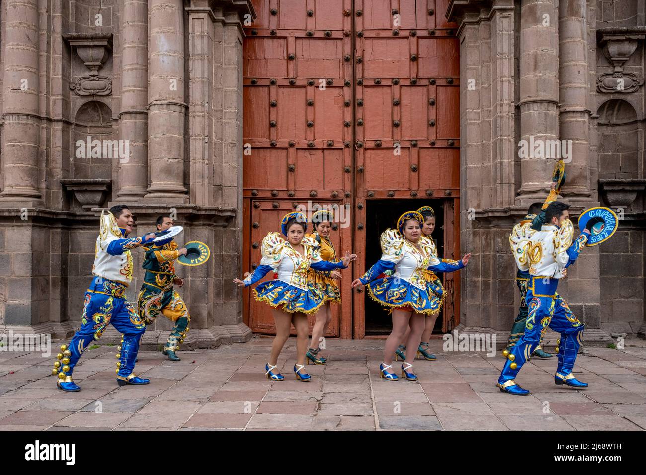 A Traditional Peruvian Dance Troupe Dancing In The Historical Centre Of