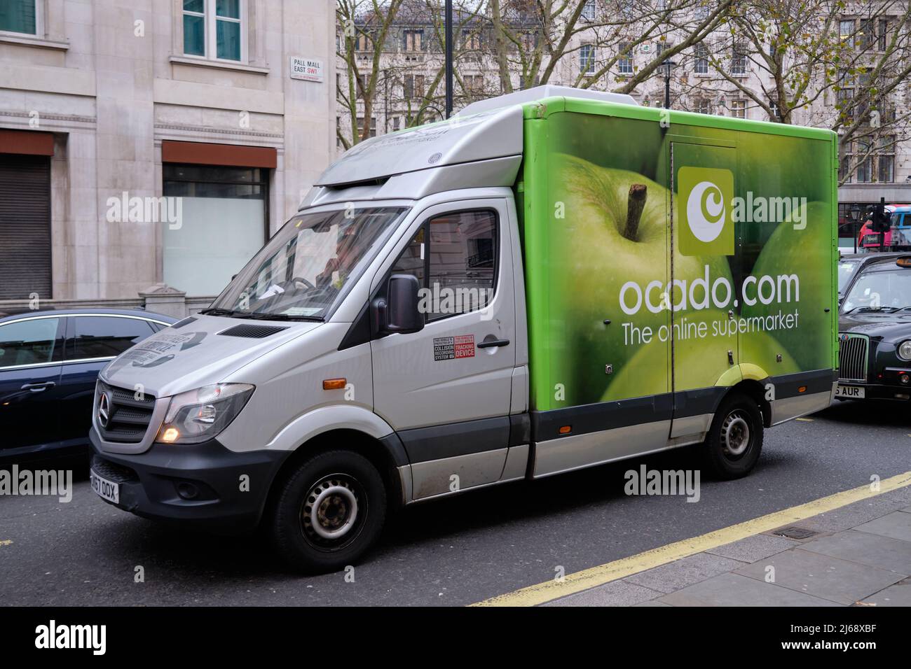 Ocado food delivery truck in traffic on streets of London Stock Photo