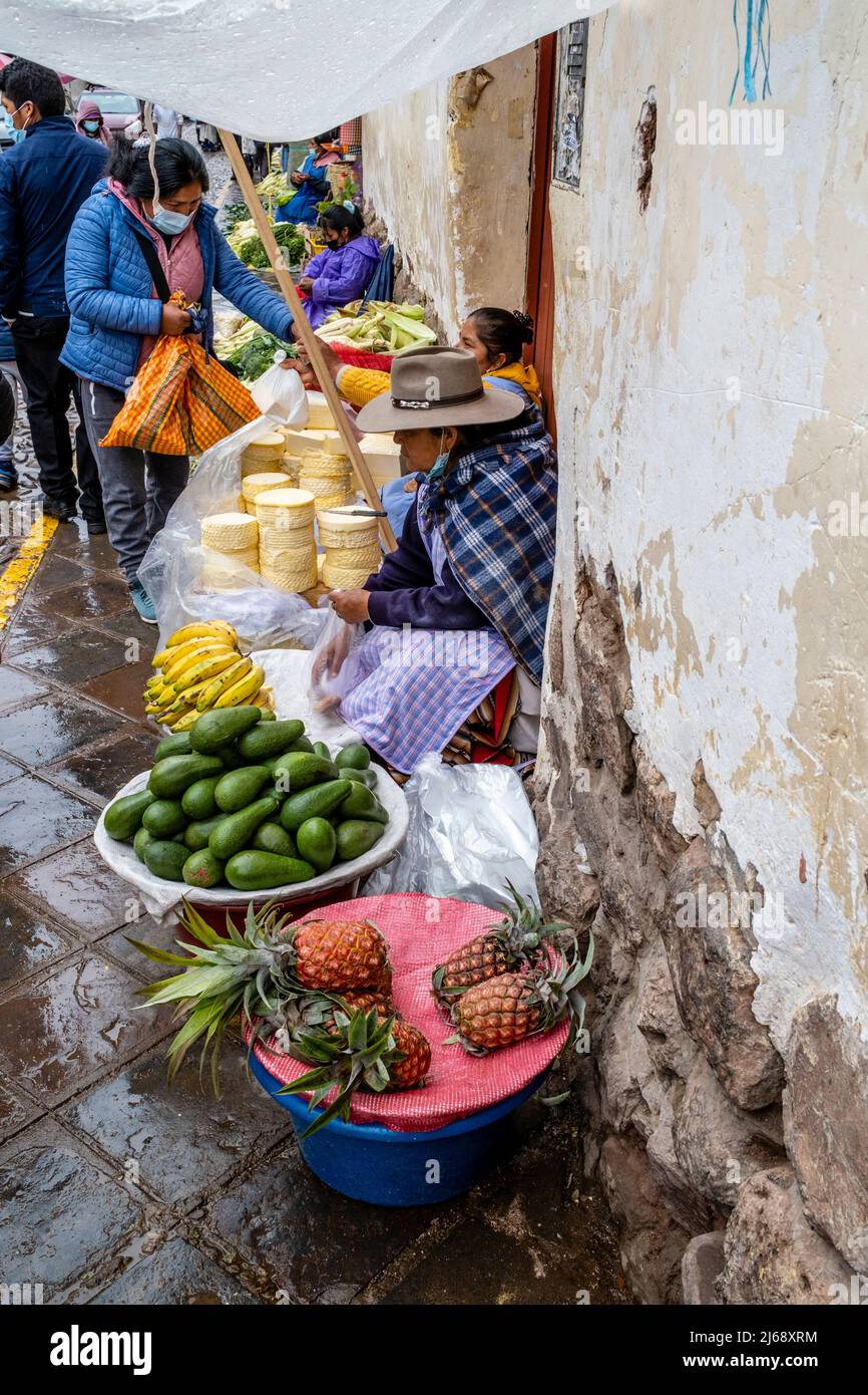 Local People Shopping For Food At An Outdoor Street Market In Cusco
