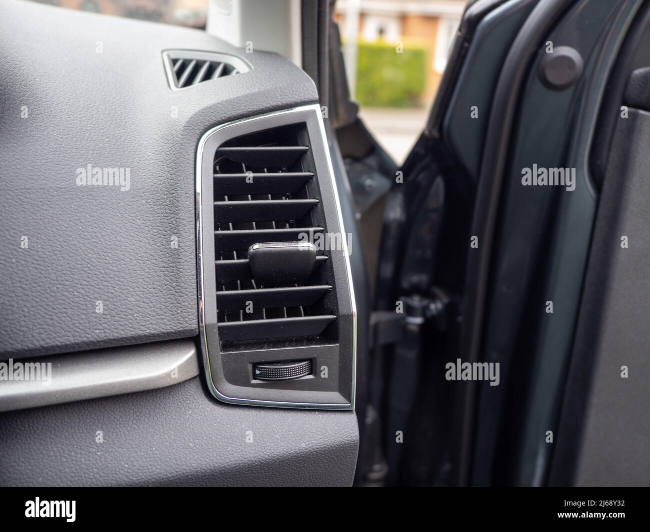 Car Drivers door open to reveal Adustable Air conditioning , ventilation and fresh air outlet Stock Photo
