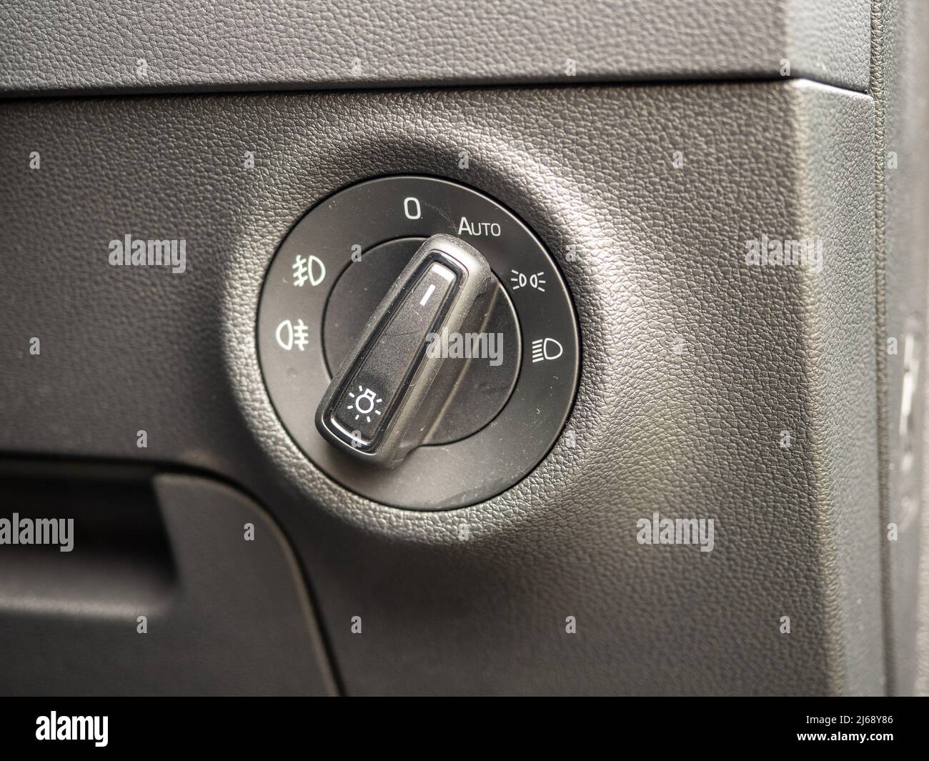typical standard Light Cluster switch to set up auto runnng light in car vehicle Stock Photo
