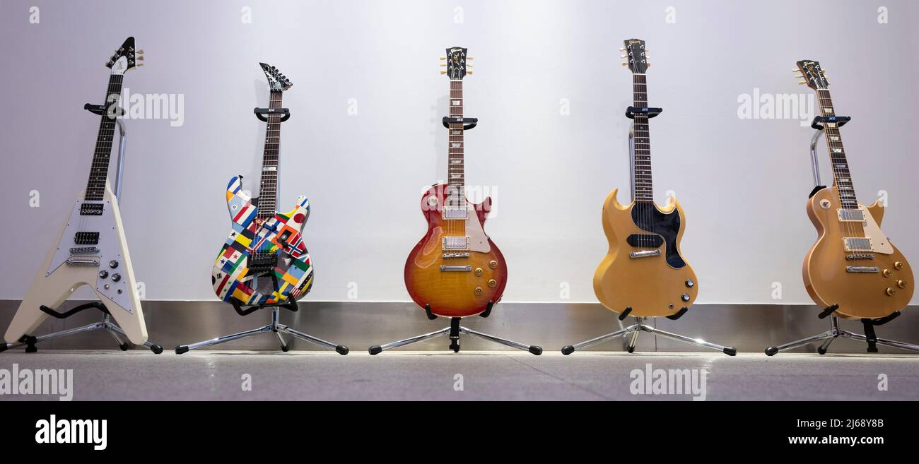 Bonhams, Knightsbridge, London, UK. 29 April 2022. Rock, Pop and Film Online sale includes the Gary Moore guitar Collection Part III, ending 4 May. Image (l to r): Gary Moore: Gibson Flying V Guitar, 2007, estimate £6,000-8,000; Jackson USA Strat Custom Guitar, 1988, estimate £2,500-3,000; Gibson Les Paul Standard 59 Reissue Guitar, Nicknamed 'Frankfurt', 2009, estimate £7,000-9,000; Gibson SG TV Guitar, 1961, estimate £5,000-6,000; Gibson Les Paul Standard Gold Top '57 VOS LPR-7 Guitar, 2007, estimate £6,000-8,000. Credit: Malcolm Park/Alamy Live News. Stock Photo