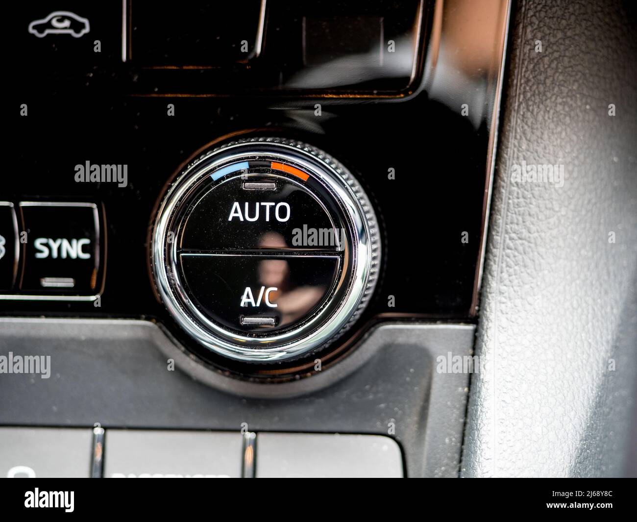 Air Conditioning control dial on the dashboard fascia of a luxury Sports utility vehicle Stock Photo
