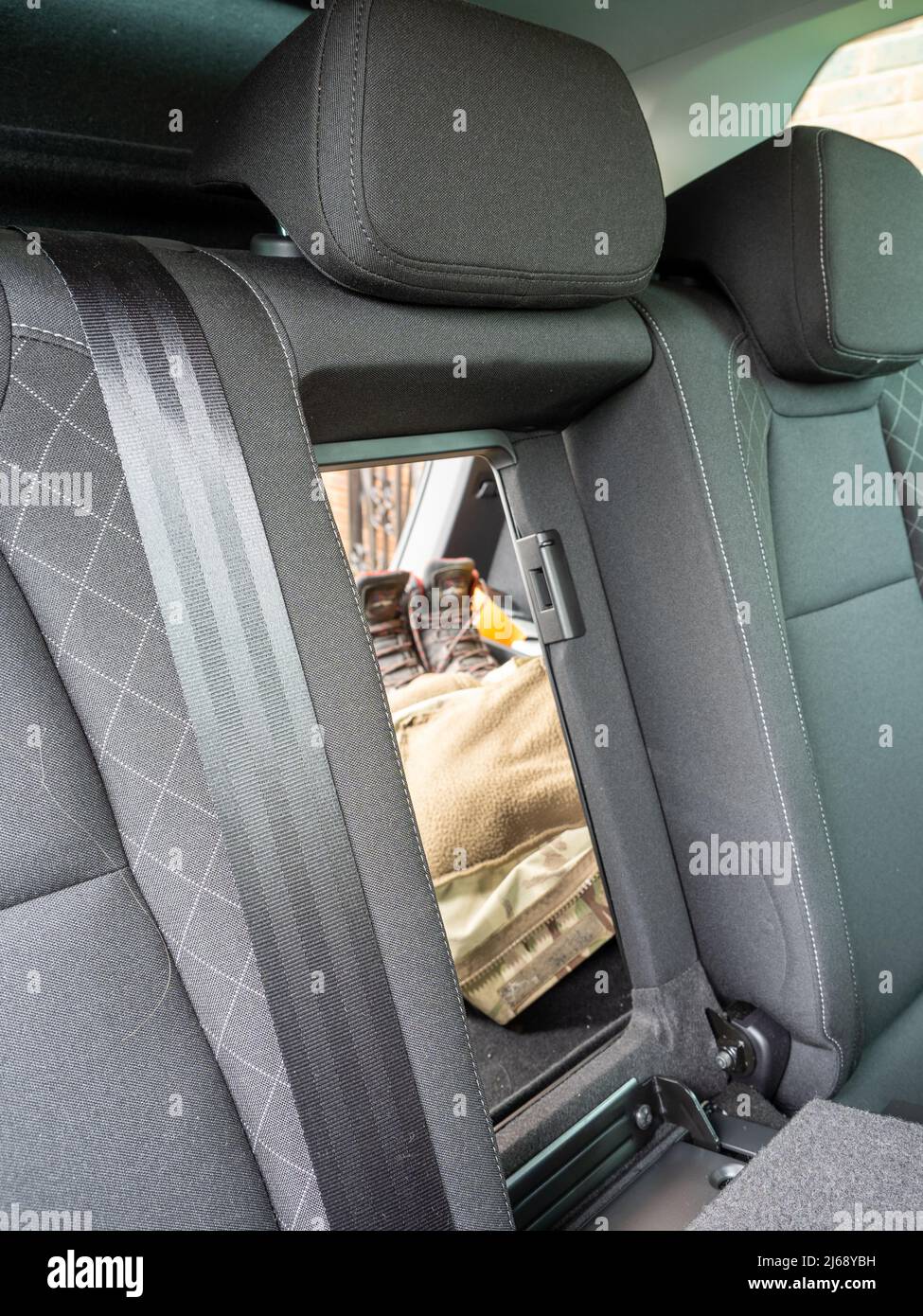 Secret Folding rear car seat hatch to access the trunk boot space Stock Photo