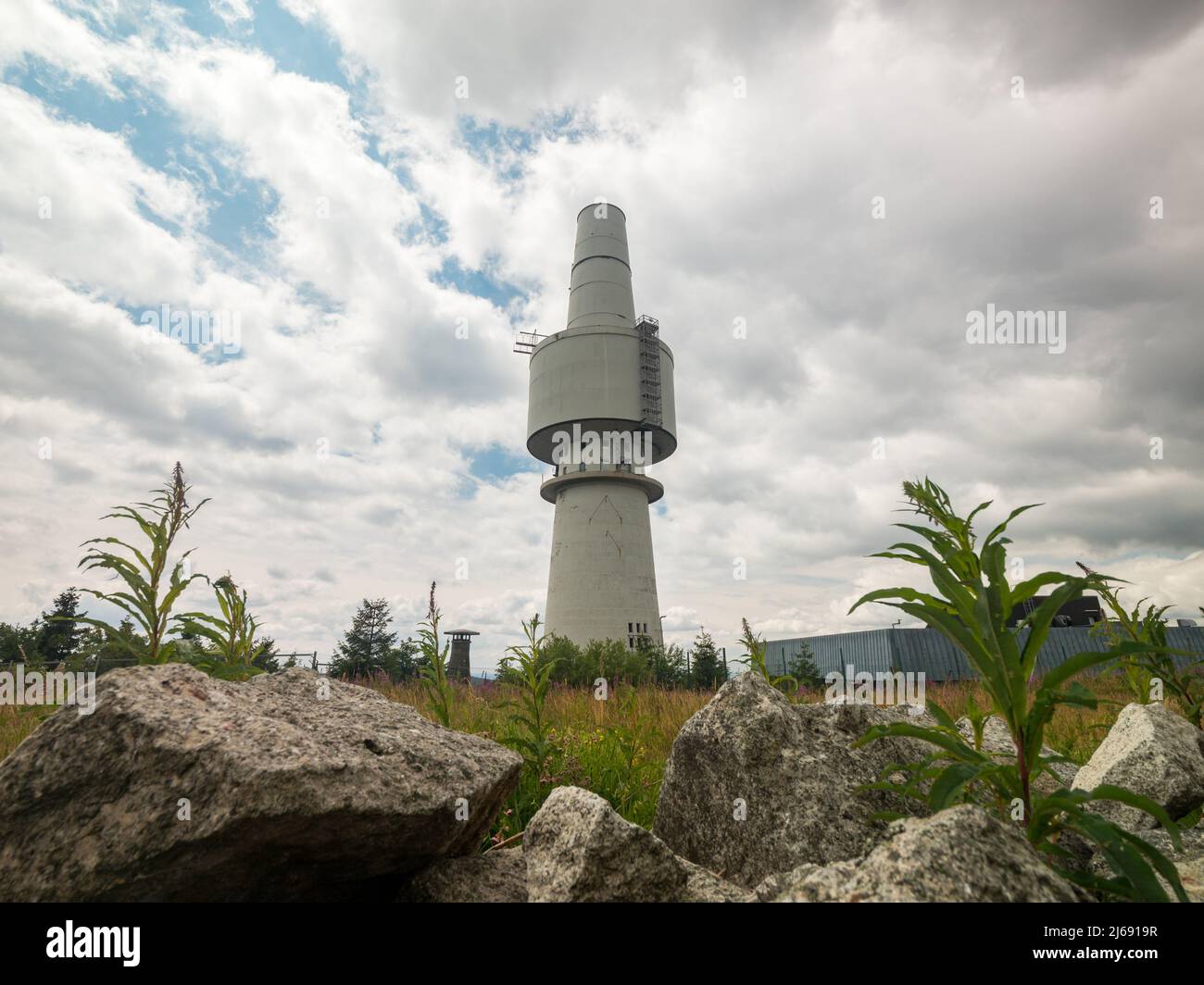Telecommunications tower of the military on a mountain. Old relic from cold war in the Fichtelgebirge. Base for communication of a news service. Stock Photo