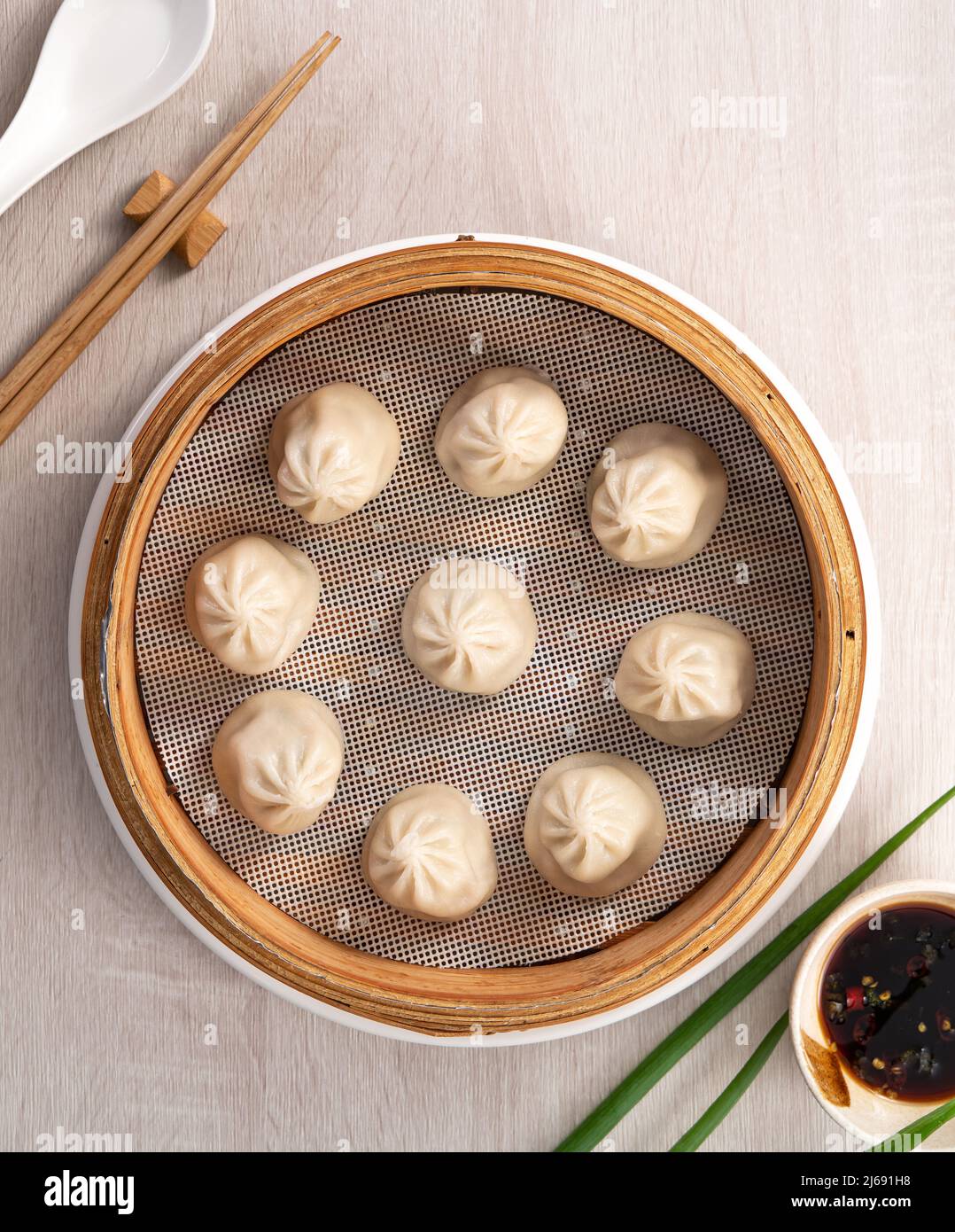 Eating steamed pork soup dumplings named Xiao long bao xiaolongbao in