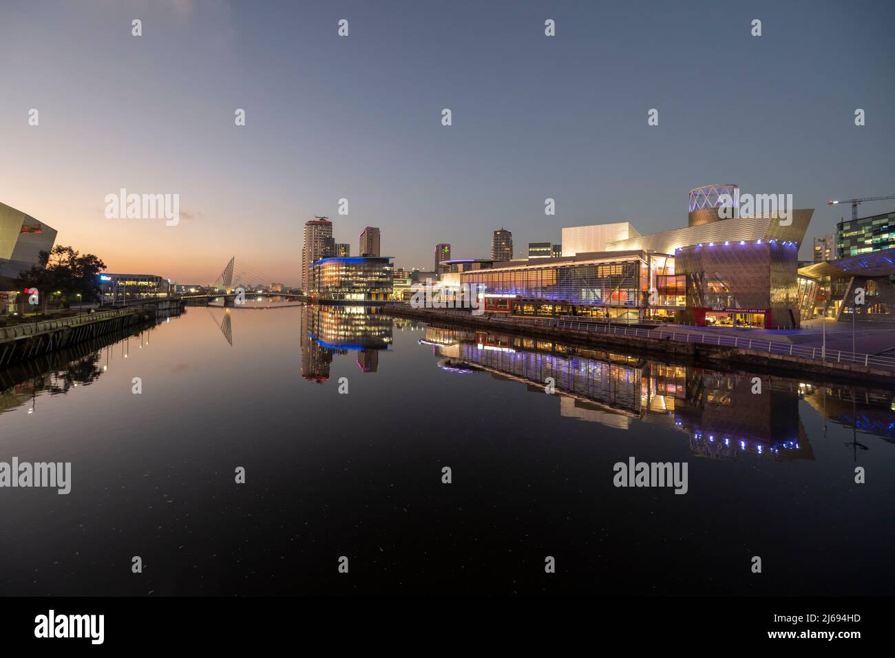 Lowry Theatre, MediCityUK and River Irwell at dusk Salford Quays, Manchester, England, United Kingdom Stock Photo