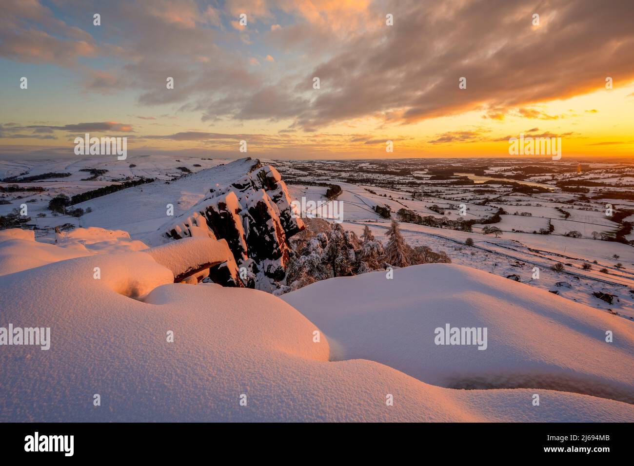 Heavy snowfall with amazing sunset at Hen Cloud, The Roaches, Staffordshire, England, United Kingdom, Europe Stock Photo