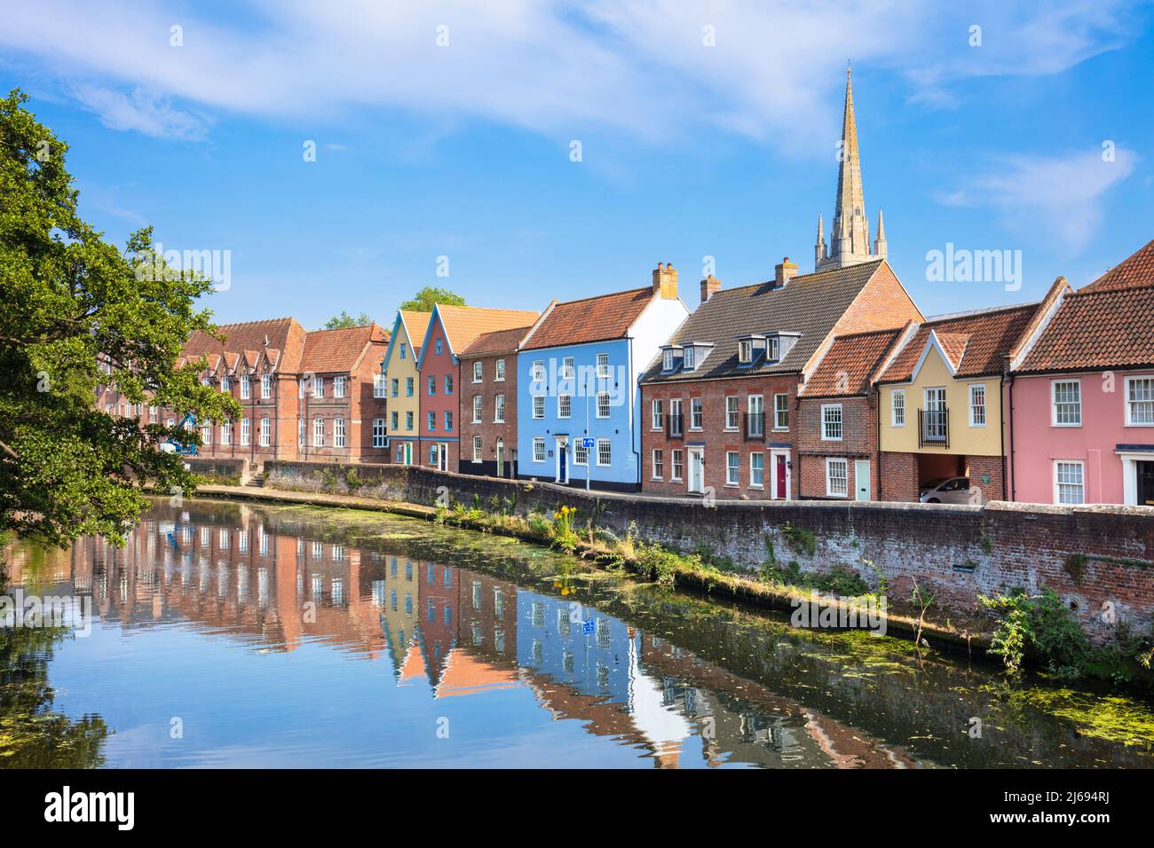 Narrow street Quayside and bright painted houses by the River Wensum, Norwich, Norfolk, East Anglia, England, United Kingdom Stock Photo