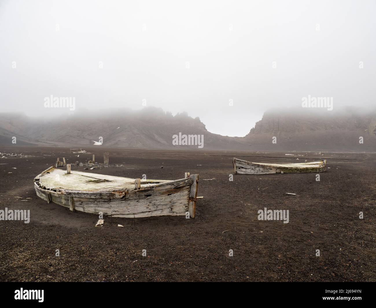 The remains of old water boats at Deception Island, an active volcano which last erupted in 1969, Antarctica, Polar Regions Stock Photo