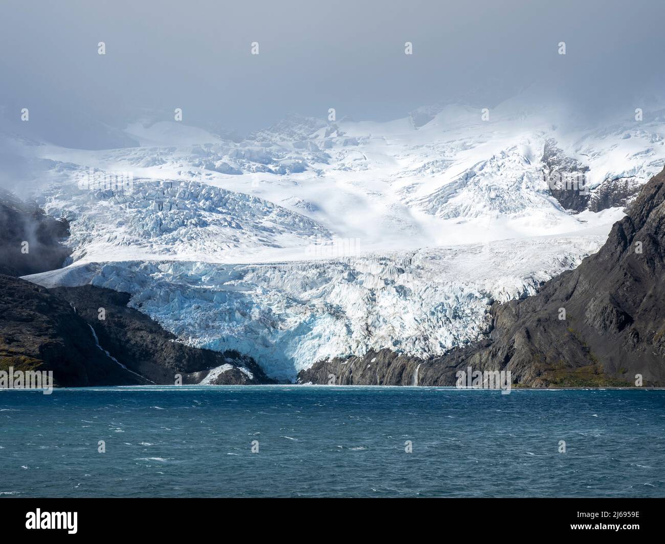 Ice and snow covered mountains with glaciers in King Haakon Bay, South Georgia, South Atlantic, Polar Regions Stock Photo