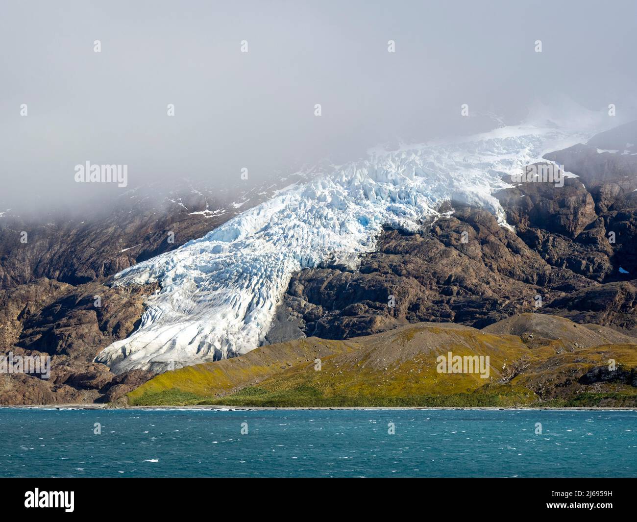 Ice and snow covered mountains with glaciers in King Haakon Bay, South Georgia, South Atlantic, Polar Regions Stock Photo