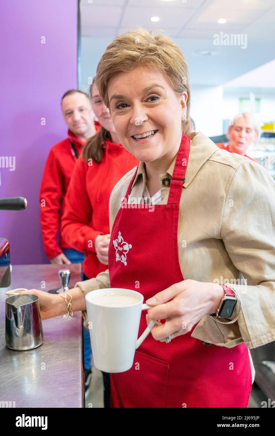First Minister of Scotland Nicola Sturgeon makes a coffee at the