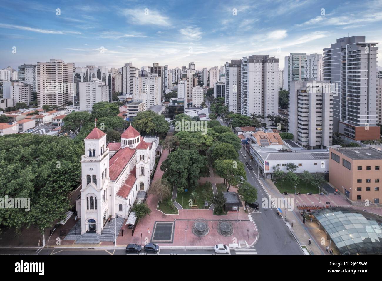 Moema neighborhood, Catholic church of Nossa Senhora Aparecida and upmarket residential apartments, Sao Paulo, Brazil Stock Photo