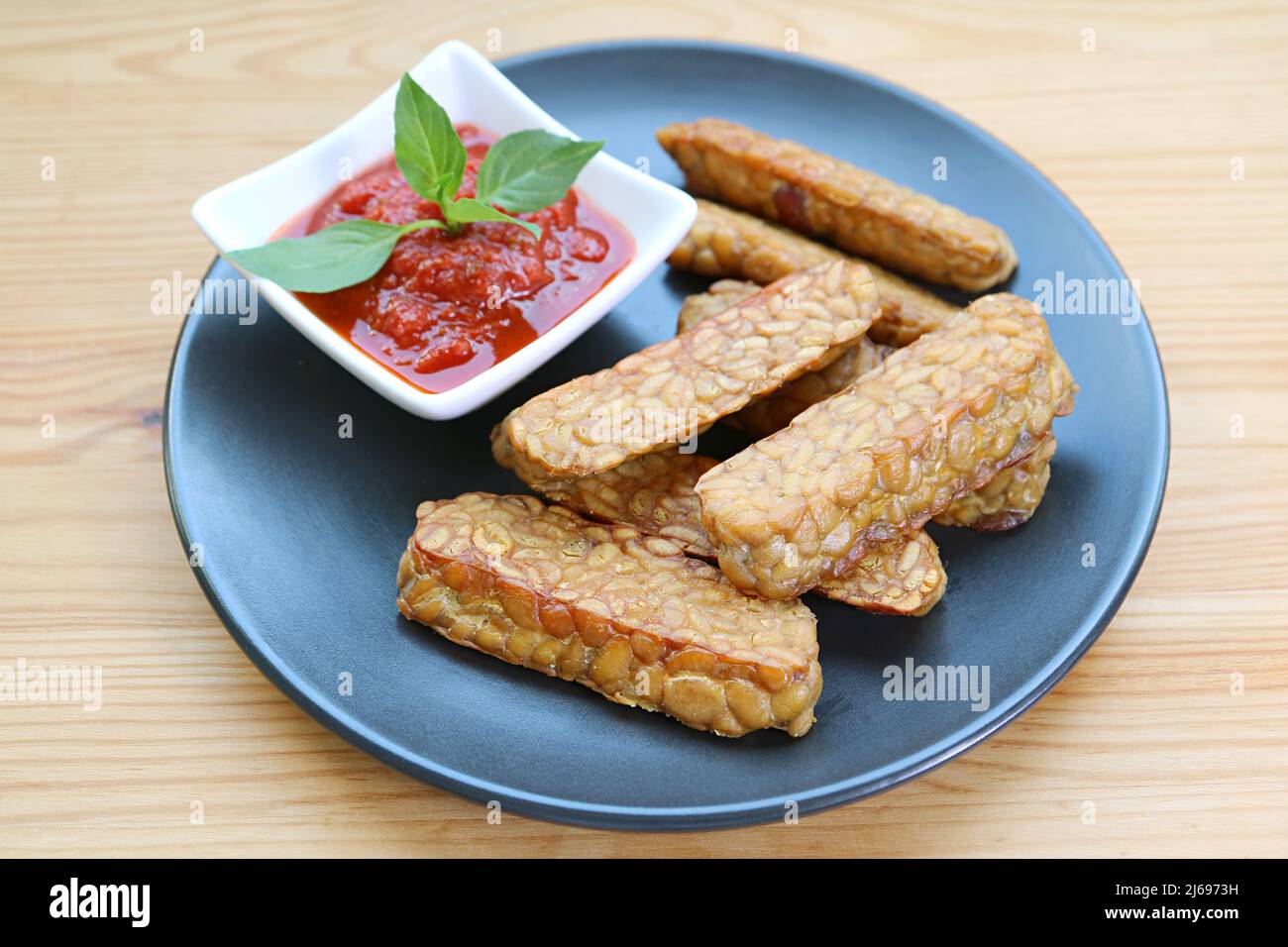 Pan fried Tempeh wih homemade marinara sauce, an easy and tasty dish of