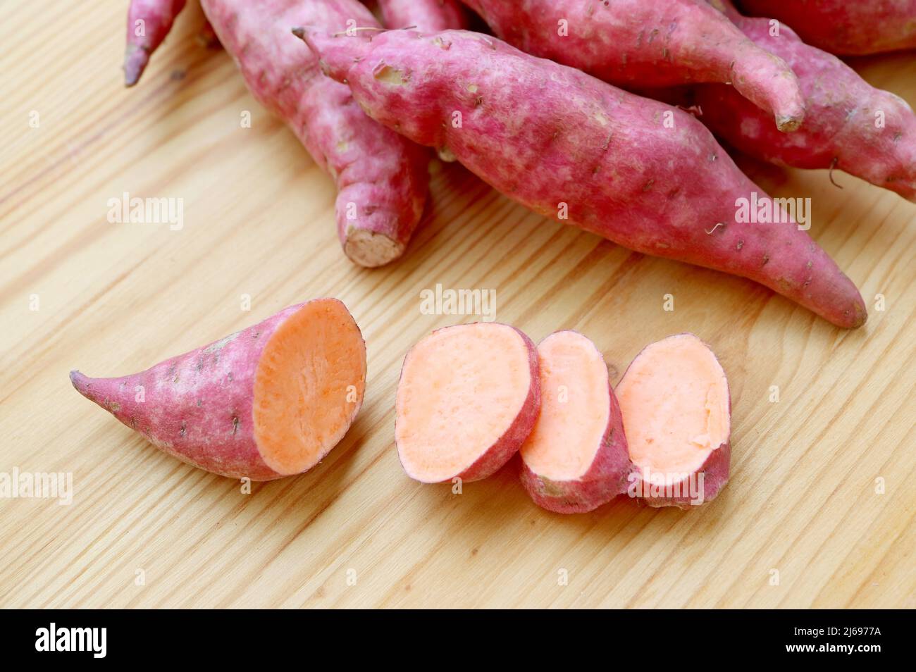 Closeup of Cut Raw Sweet Potato Showing Its Pale Orange Flesh Stock Photo