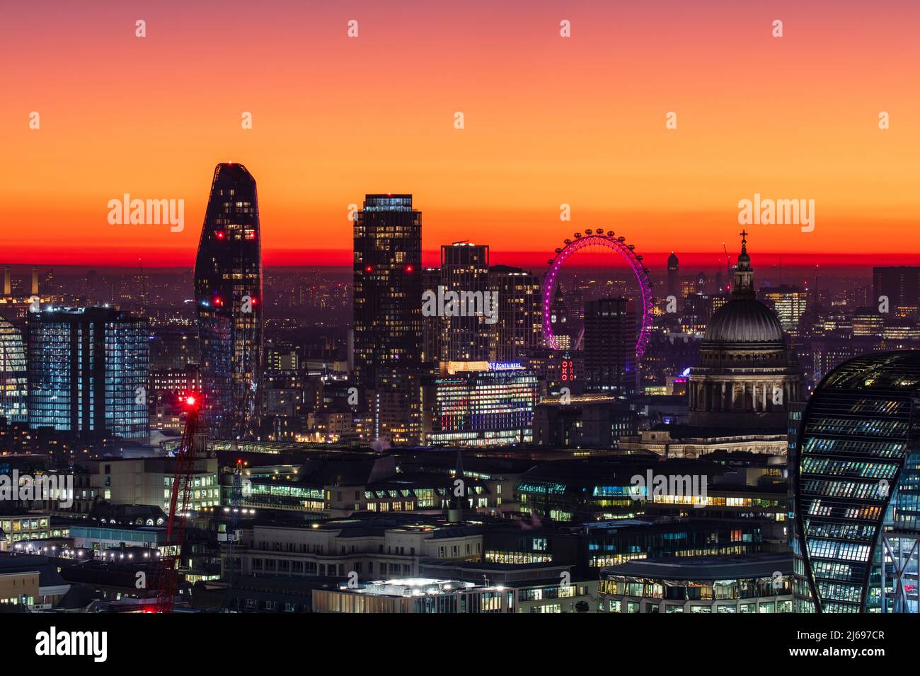 Aerial view of London skyline at sunset, including London Eye and St. Paul's Cathedral, London