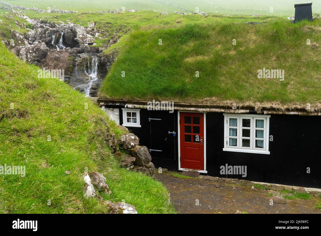 House with turf roof, Mykines Island, Faroe Islands, Denmark, Europe Stock Photo